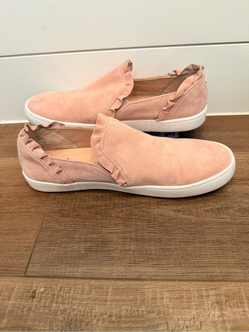 Kate Spade New York Lilly Ruffle Slip-On Sneaker in the "Conch Shell" pink